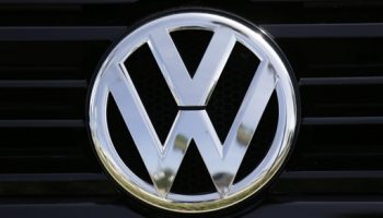 The Volkswagen logo is seen on car offered for sale at New Century Volkswagen dealership in Glendale, Calif., Monday, Sept. 21, 2015. Volkswagen shares plunged Monday after U.S. regulators accused the German automaker of cheating on emissions tests, alleging that nearly 500,000 cars weren't meeting federal standards. (AP Photo/Damian Dovarganes)